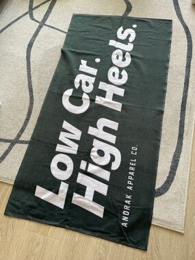 Anorak Apparel Low Car. High Heels. Beach towel